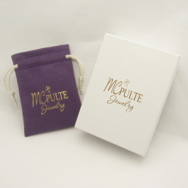 Amethyst Charisma jewelry pouch with white swirl box