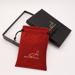 Colonial Red Ultrasuede Light jewelry pouch with black embossed box